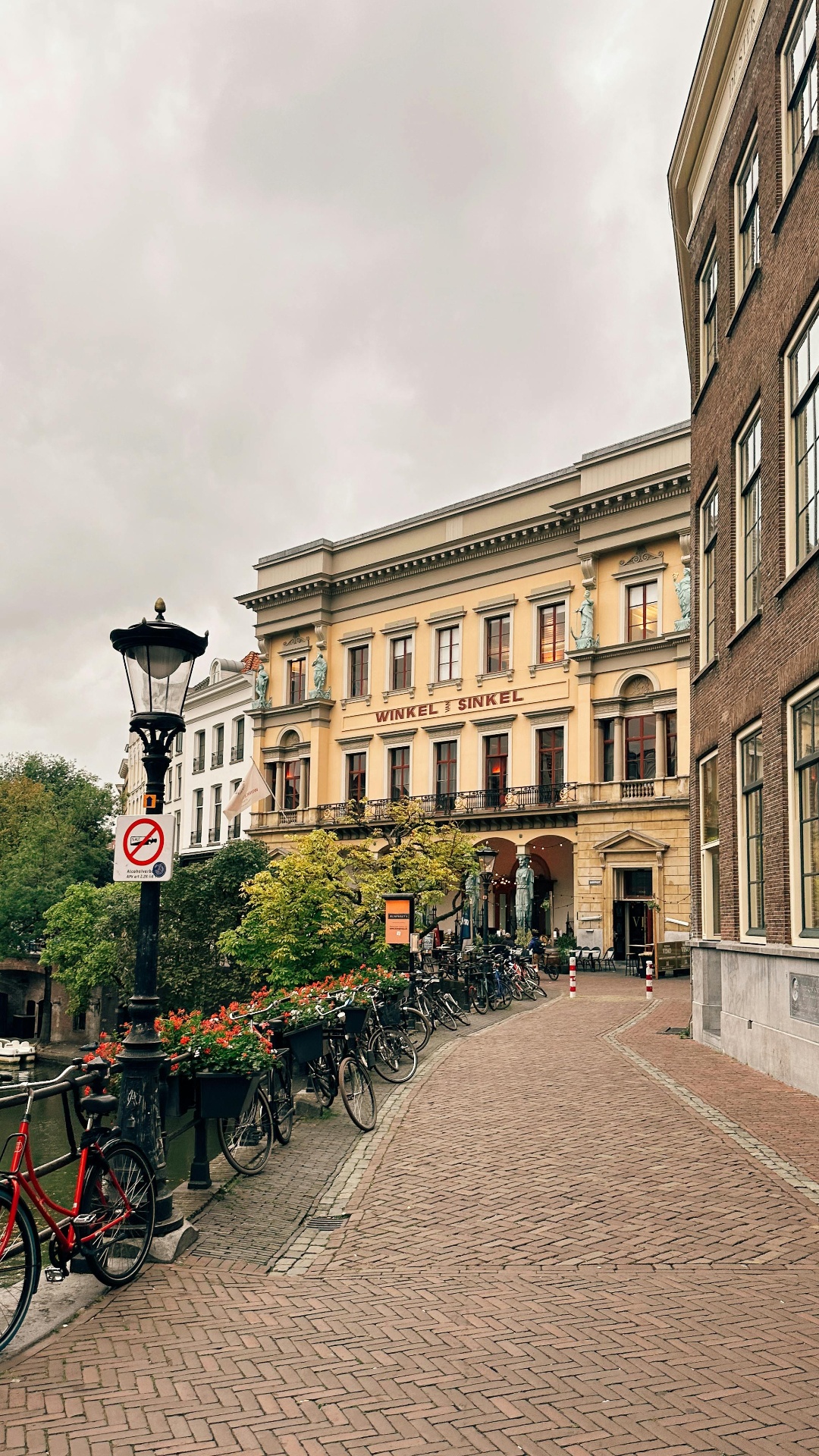 Tour group exploring the unique Oudegracht canal with its characteristic wharf cellars in Utrecht